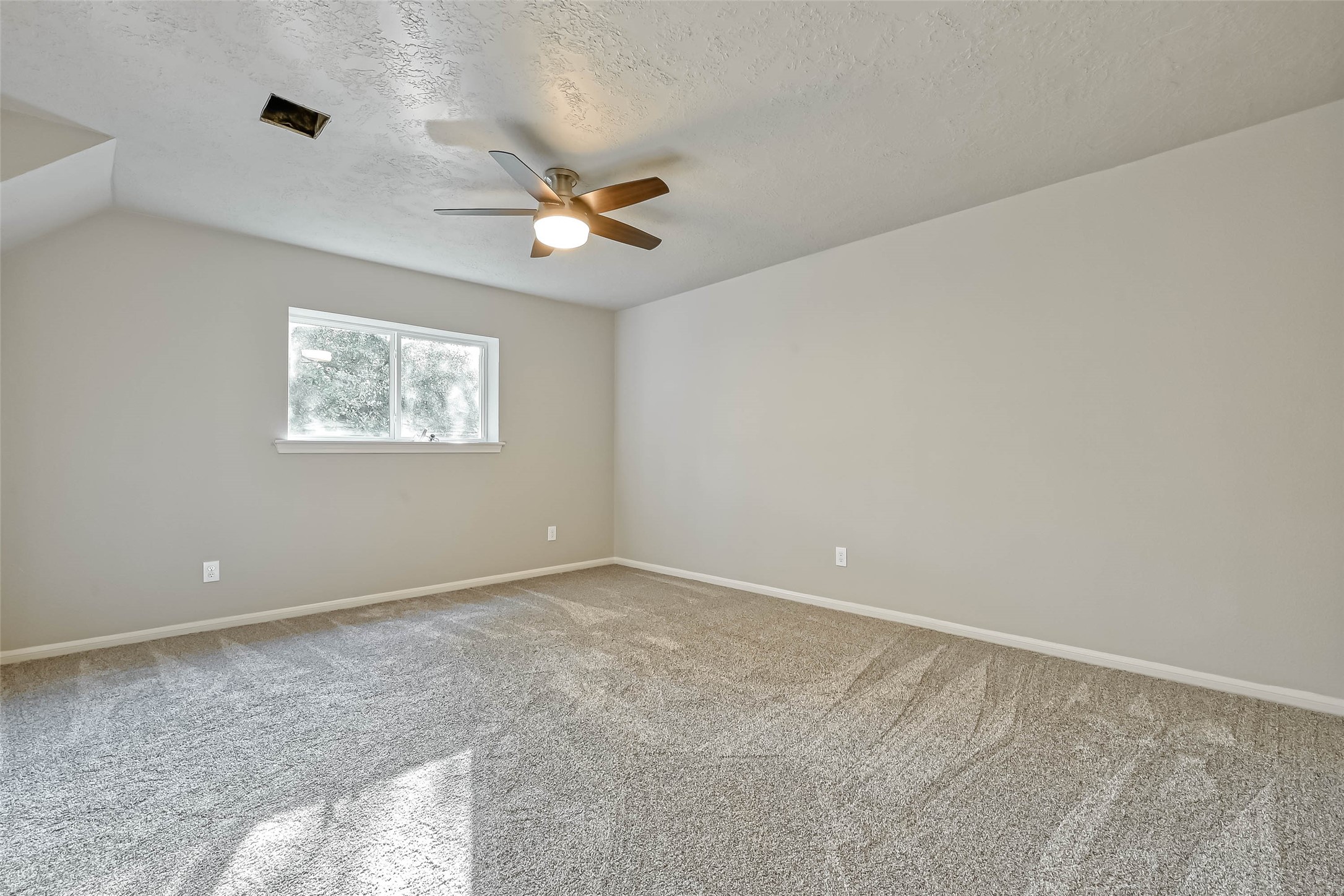 3615 Highfalls Drive Houston, TX 77068 - Photo 27 of 45 a view of an empty room with a window