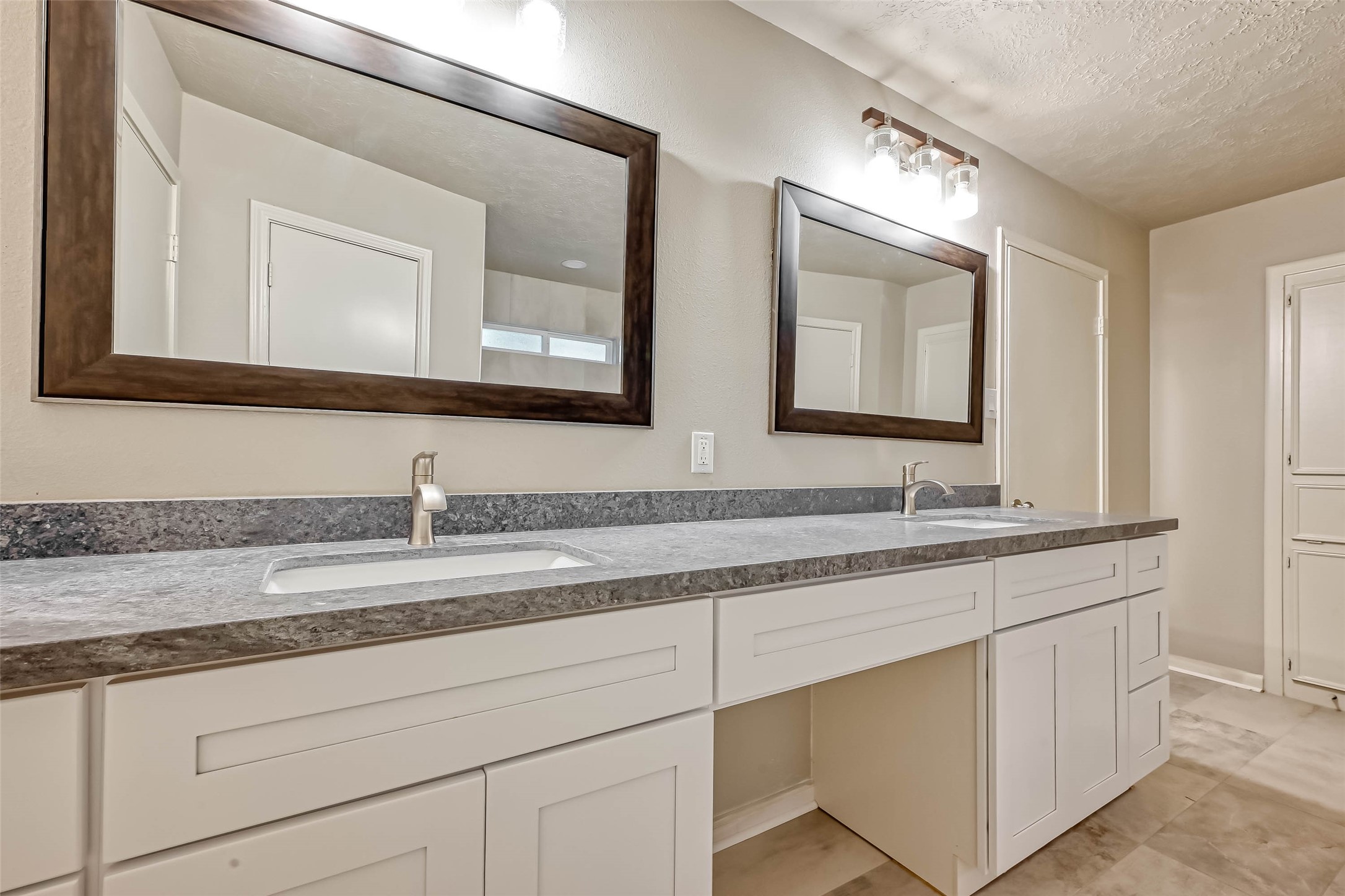 3615 Highfalls Drive Houston, TX 77068 - Photo 35 of 45 a bathroom with a granite countertop double sink and a mirror