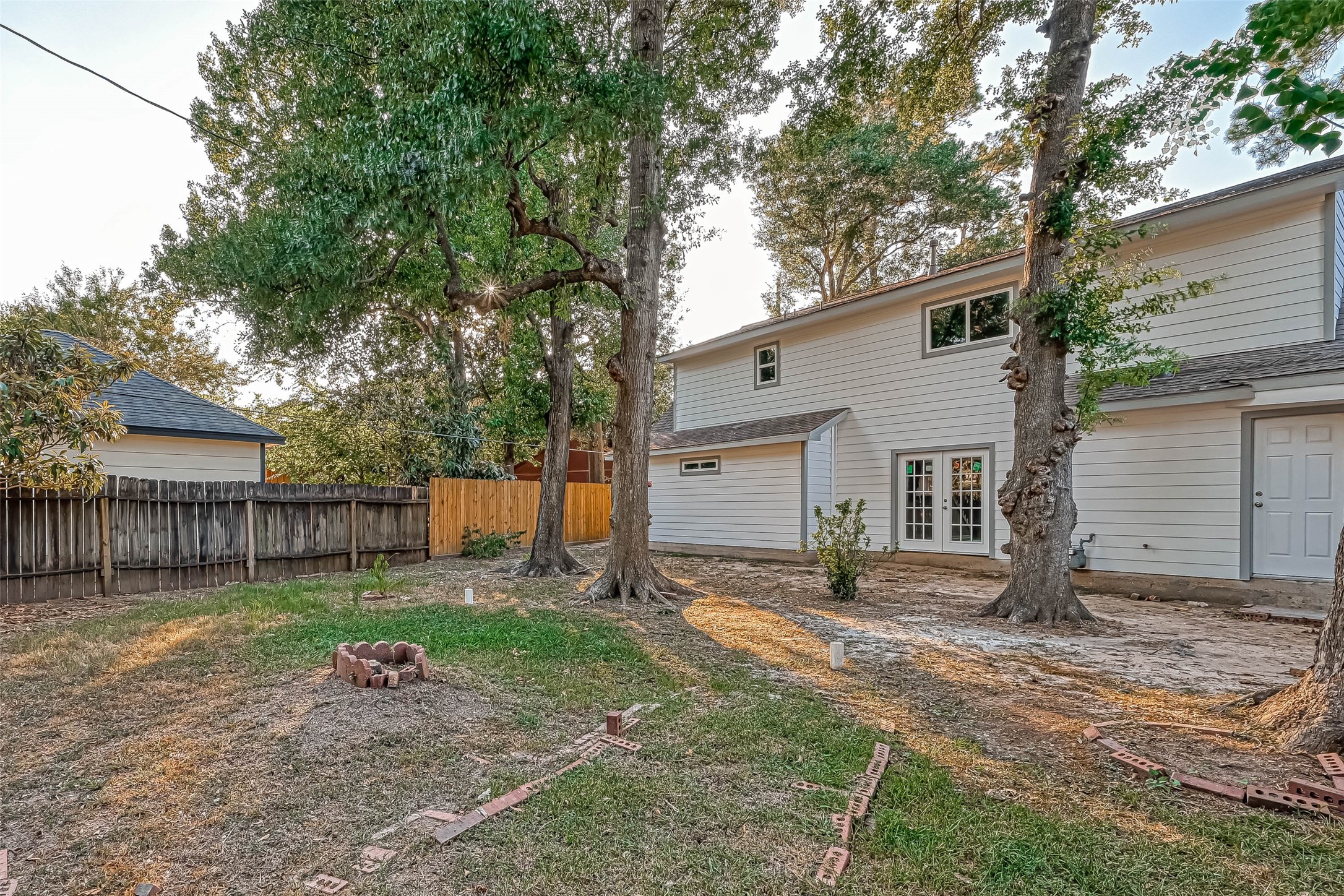 3615 Highfalls Drive Houston, TX 77068 - Photo 45 of 45 a view of a backyard with a chair and wooden fence