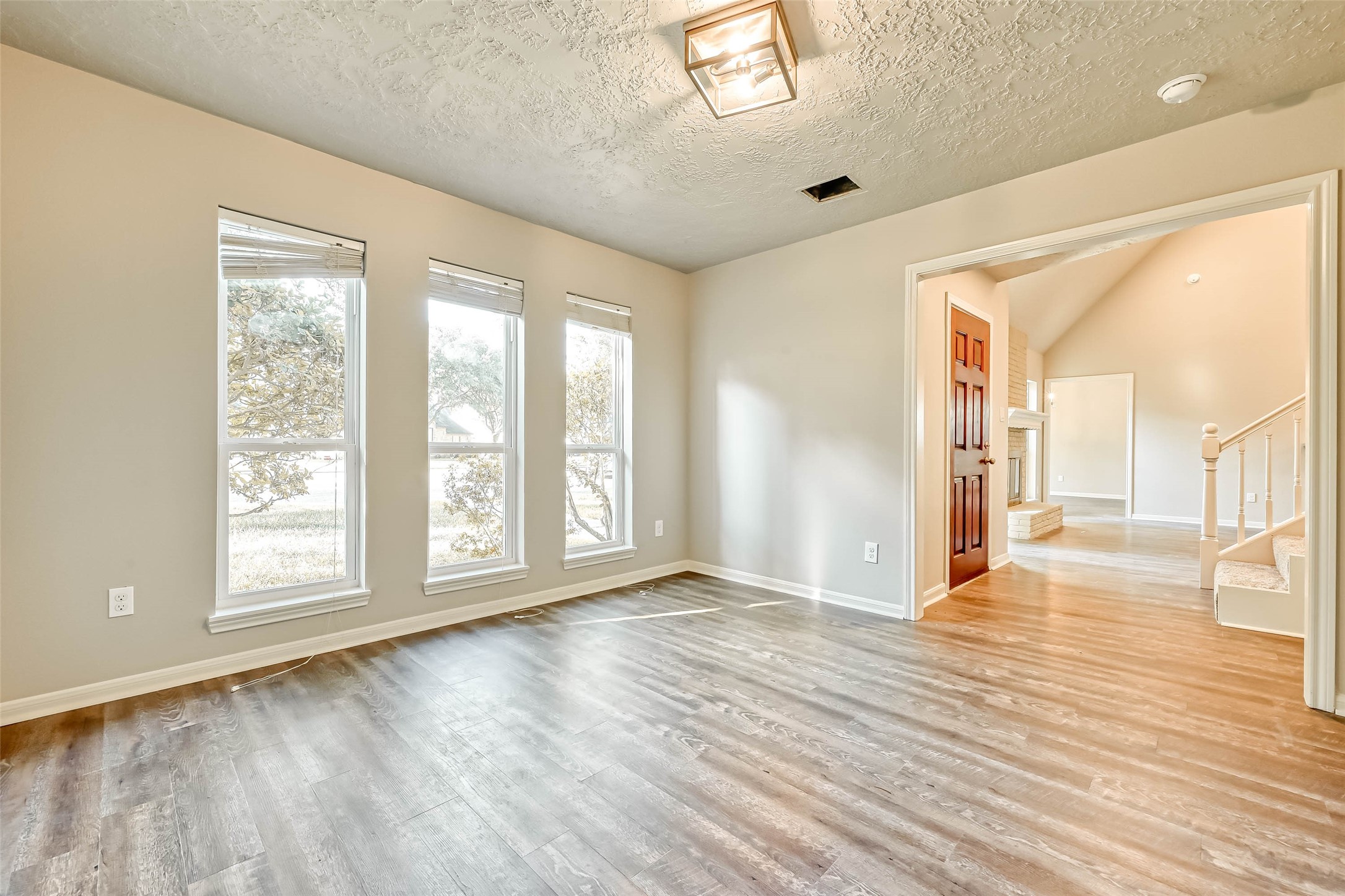 3615 Highfalls Drive Houston, TX 77068 - Photo 6 of 45 a view of an empty room with wooden floor and a window