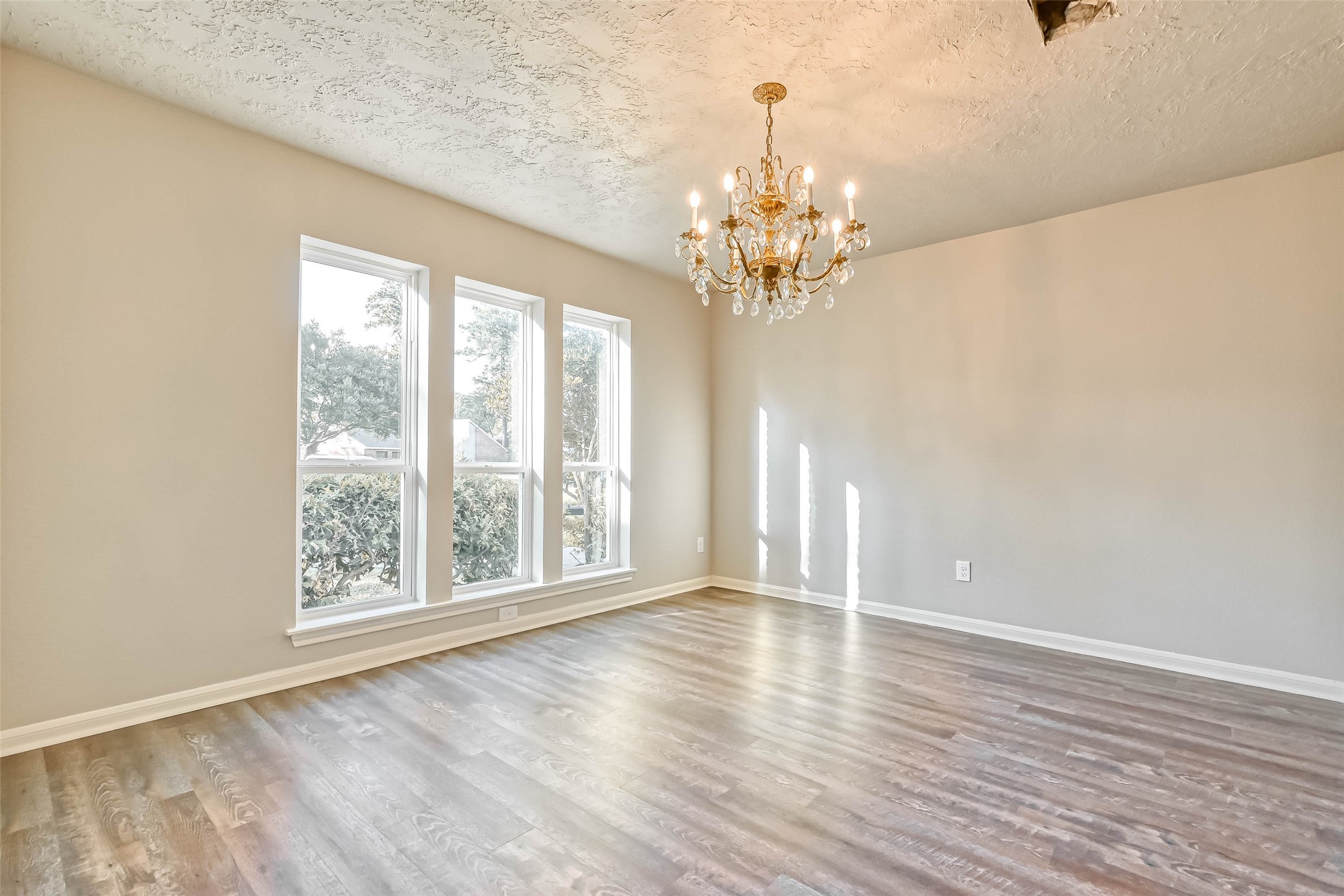 3615 Highfalls Drive Houston, TX 77068 - Photo 8 of 45 a view of an empty room with wooden floor and a window