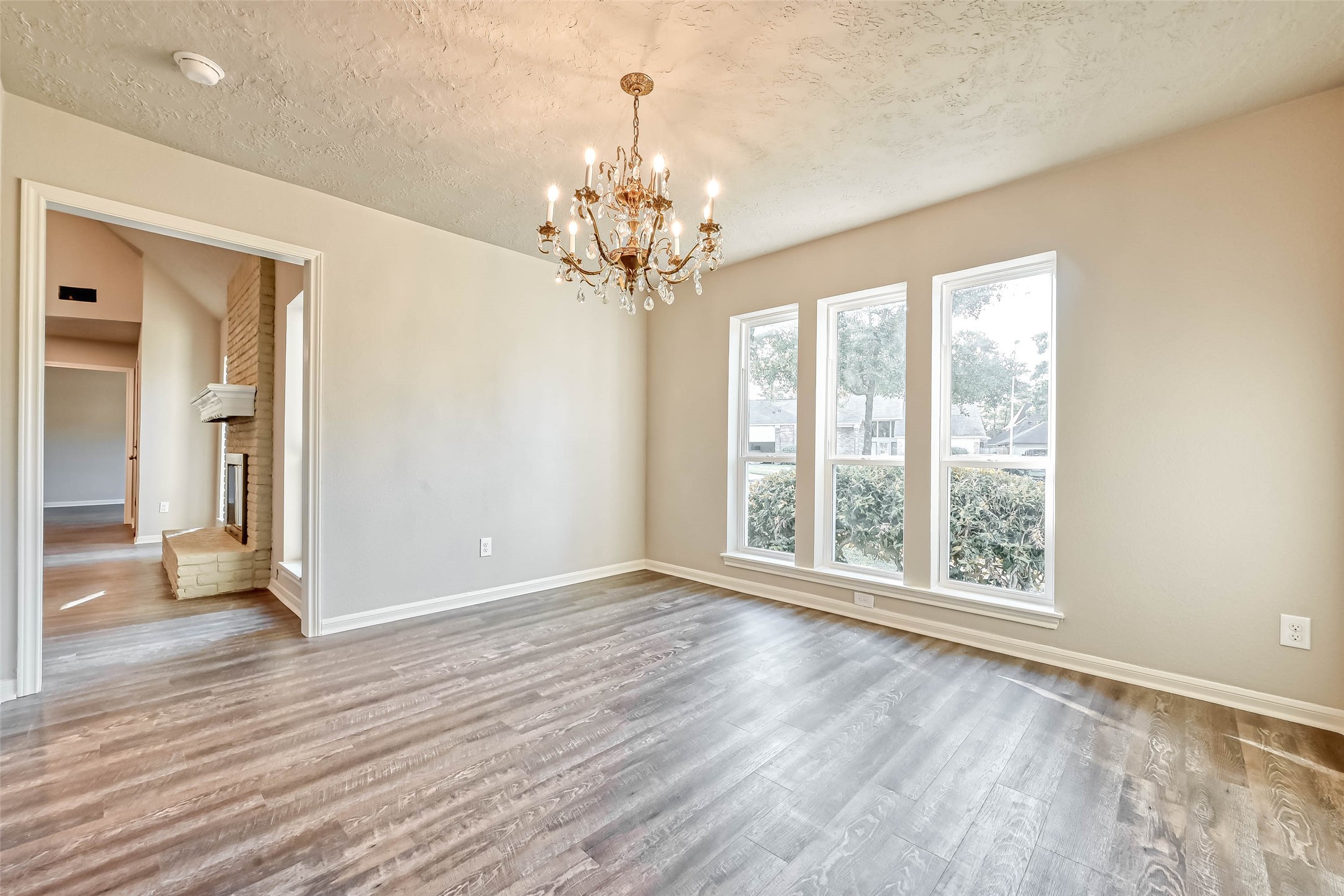 3615 Highfalls Drive Houston, TX 77068 - Photo 10 of 45 a view of an empty room with wooden floor and a window