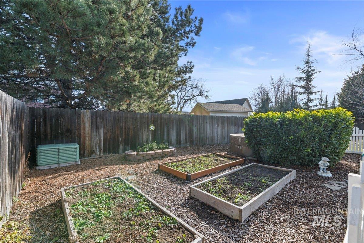 6326 North Talcrest Place Boise, ID 83713 - Photo 33 of 34 Fenced backyard with a vegetable garden