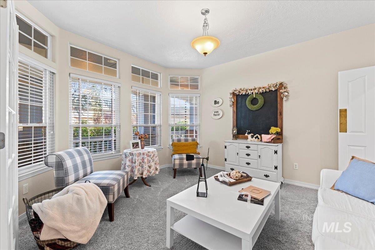 6326 North Talcrest Place Boise, ID 83713 - Photo 5 of 34 Carpeted living area with baseboards