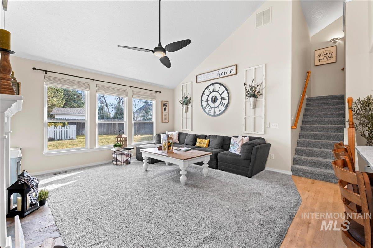 6326 North Talcrest Place Boise, ID 83713 - Photo 7 of 34 Living area with vaulted ceiling, a ceiling fan, and light wood finished floors