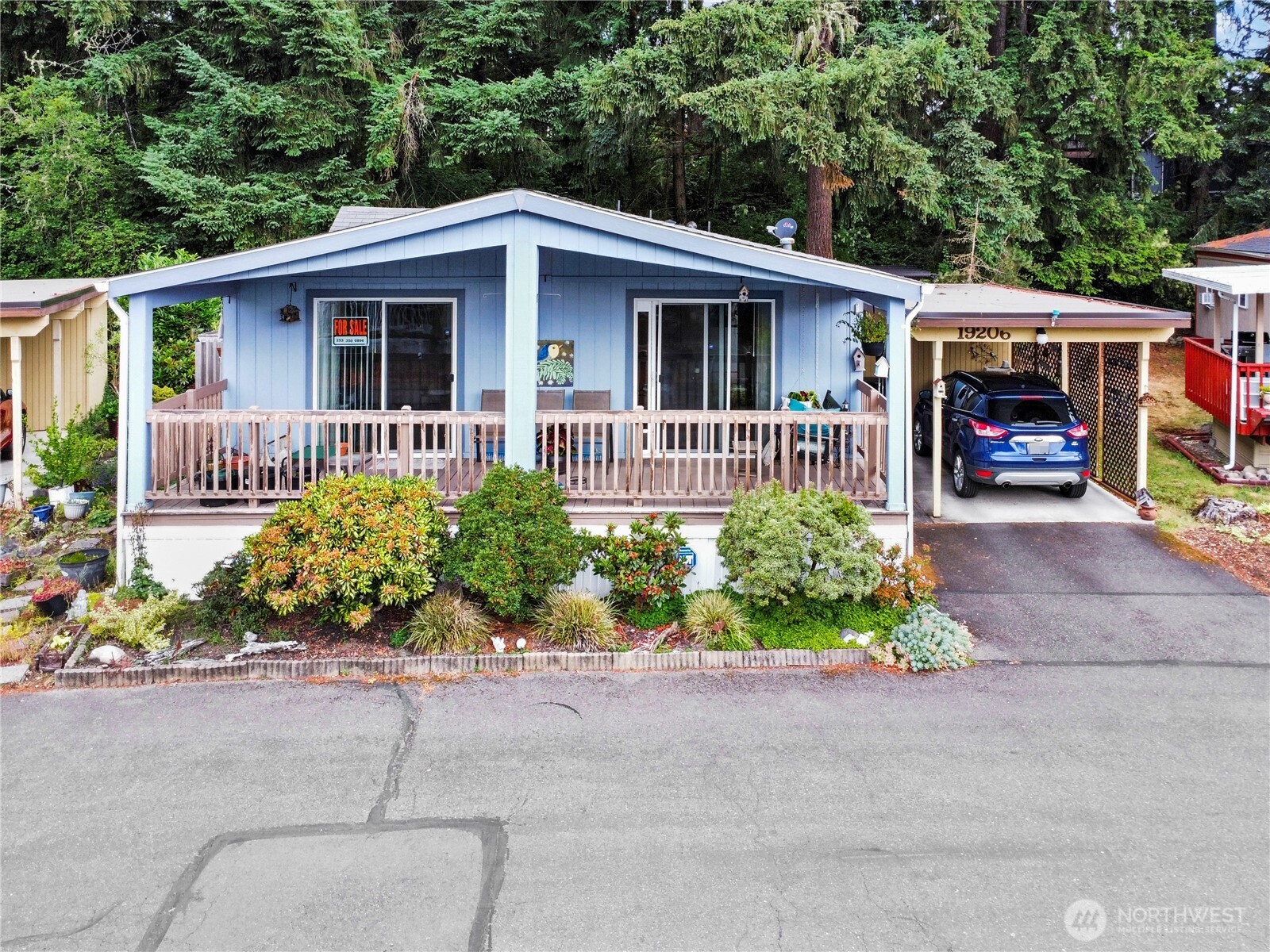 19206 99th Avenue East, Unit 48 Graham, WA 98338 - Photo 1 of 28 front view of a house with a yard
