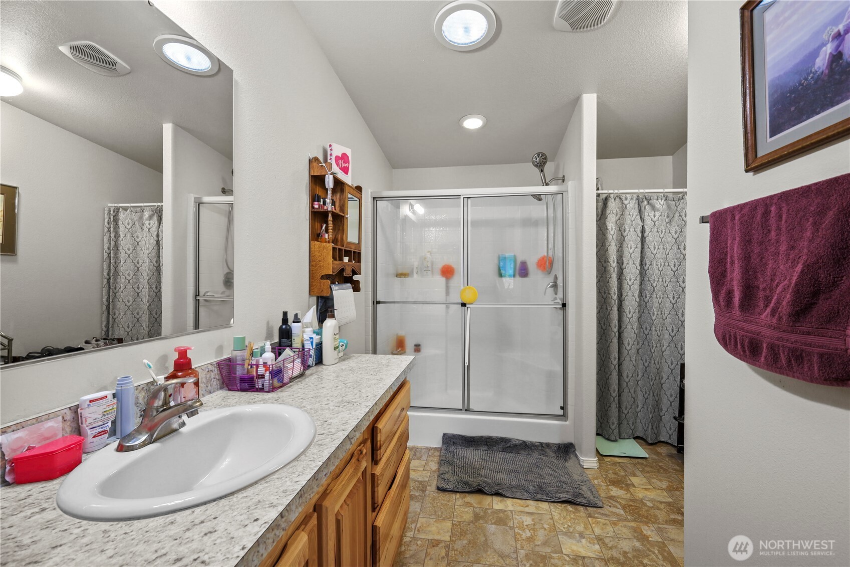 19206 99th Avenue East, Unit 48 Graham, WA 98338 - Photo 11 of 28 a bathroom with a sink and a mirror