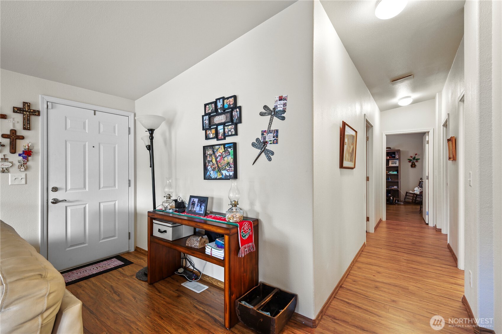 19206 99th Avenue East, Unit 48 Graham, WA 98338 - Photo 13 of 28 a view of a hallway with workspace and wooden floor
