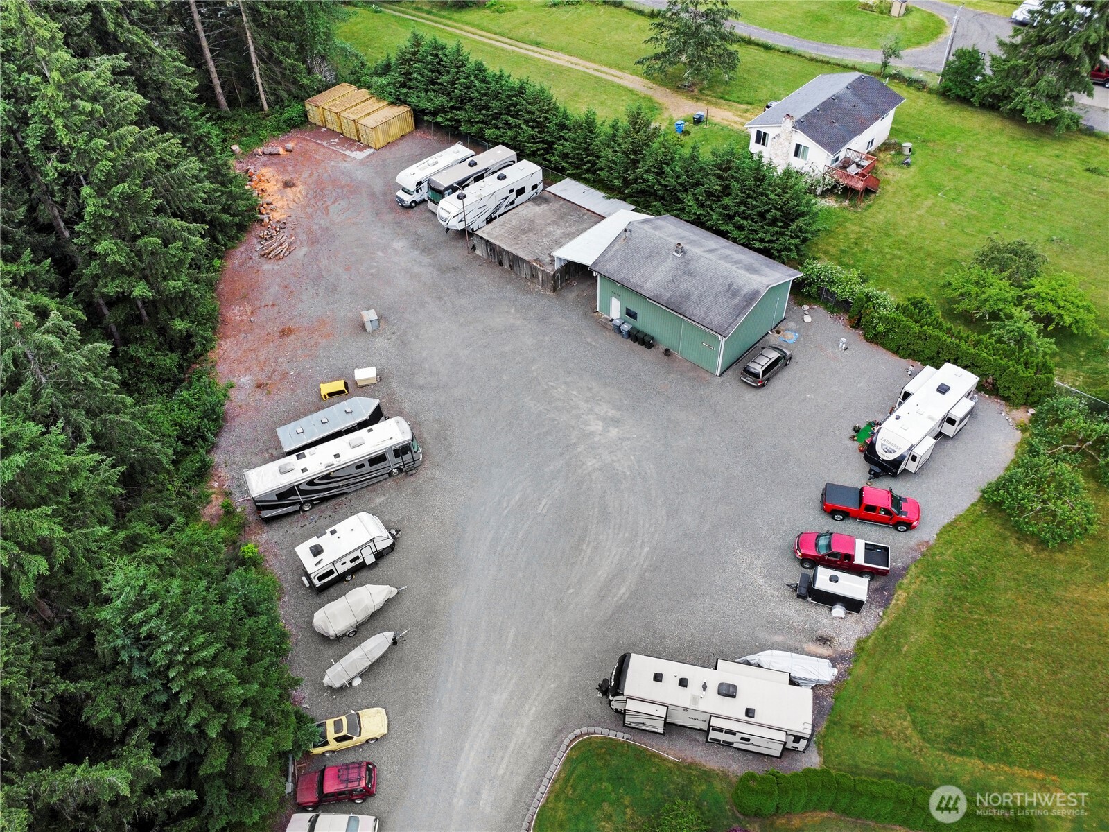 19206 99th Avenue East, Unit 48 Graham, WA 98338 - Photo 27 of 28 an aerial view of a house with garden space and street view