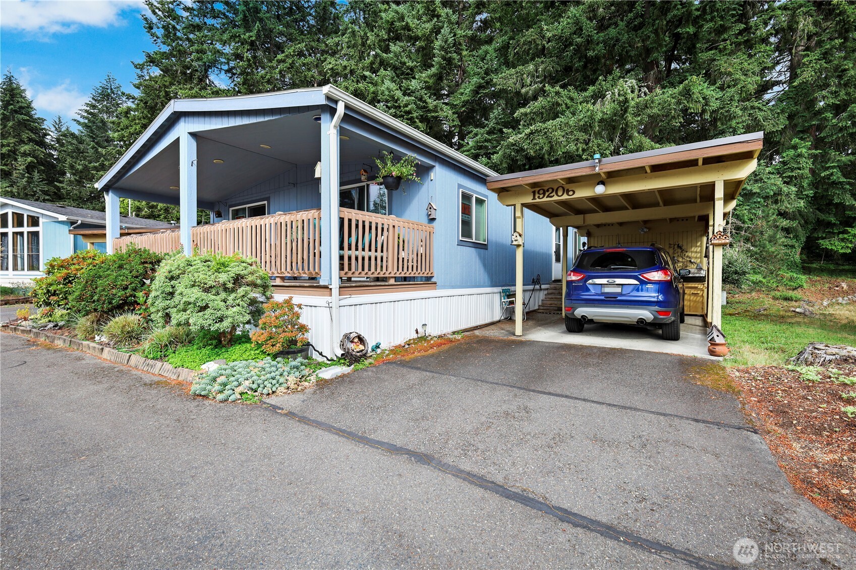 19206 99th Avenue East, Unit 48 Graham, WA 98338 - Photo 28 of 28 a front view of a house with a yard