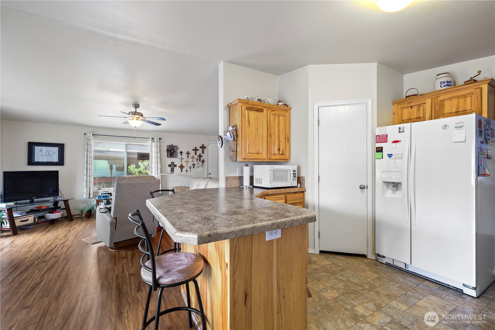 19206 99th Avenue East, Unit 48 Graham, WA 98338 - Photo 3 of 28 a kitchen with stainless steel appliances granite countertop a stove refrigerator and a refrigerator