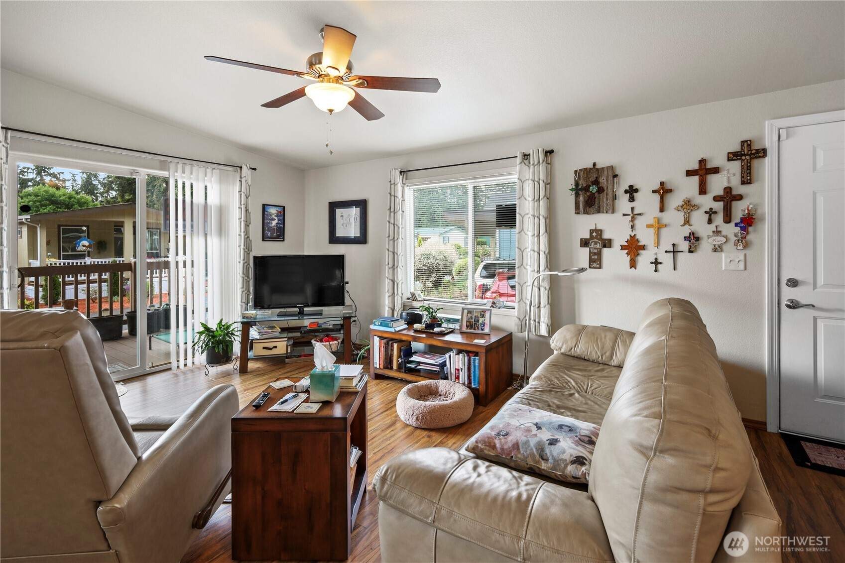 19206 99th Avenue East, Unit 48 Graham, WA 98338 - Photo 6 of 28 a living room with furniture and a flat screen tv