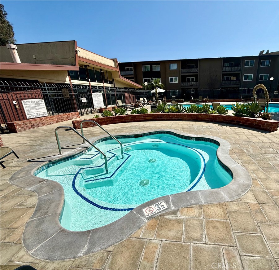 12200 Montecito Road, Unit D221 Seal Beach, CA 90740 - Photo 13 of 25 Spa with plenty of tables poolside
