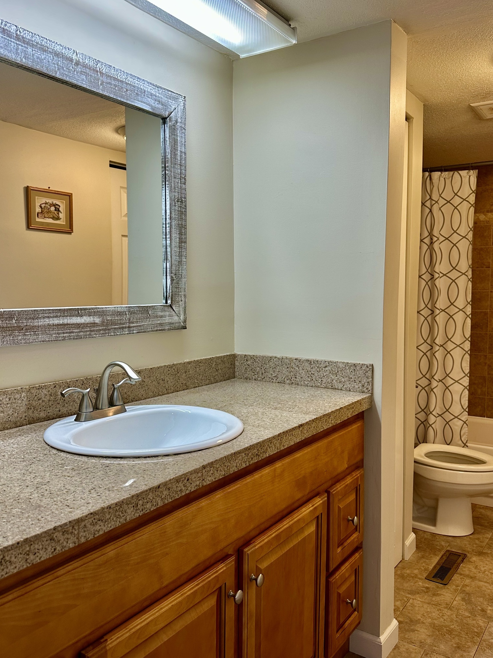 30 Orange Road, Unit 30 Middletown, CT 06457 - Photo 16 of 28 a bathroom with a granite countertop sink and a mirror
