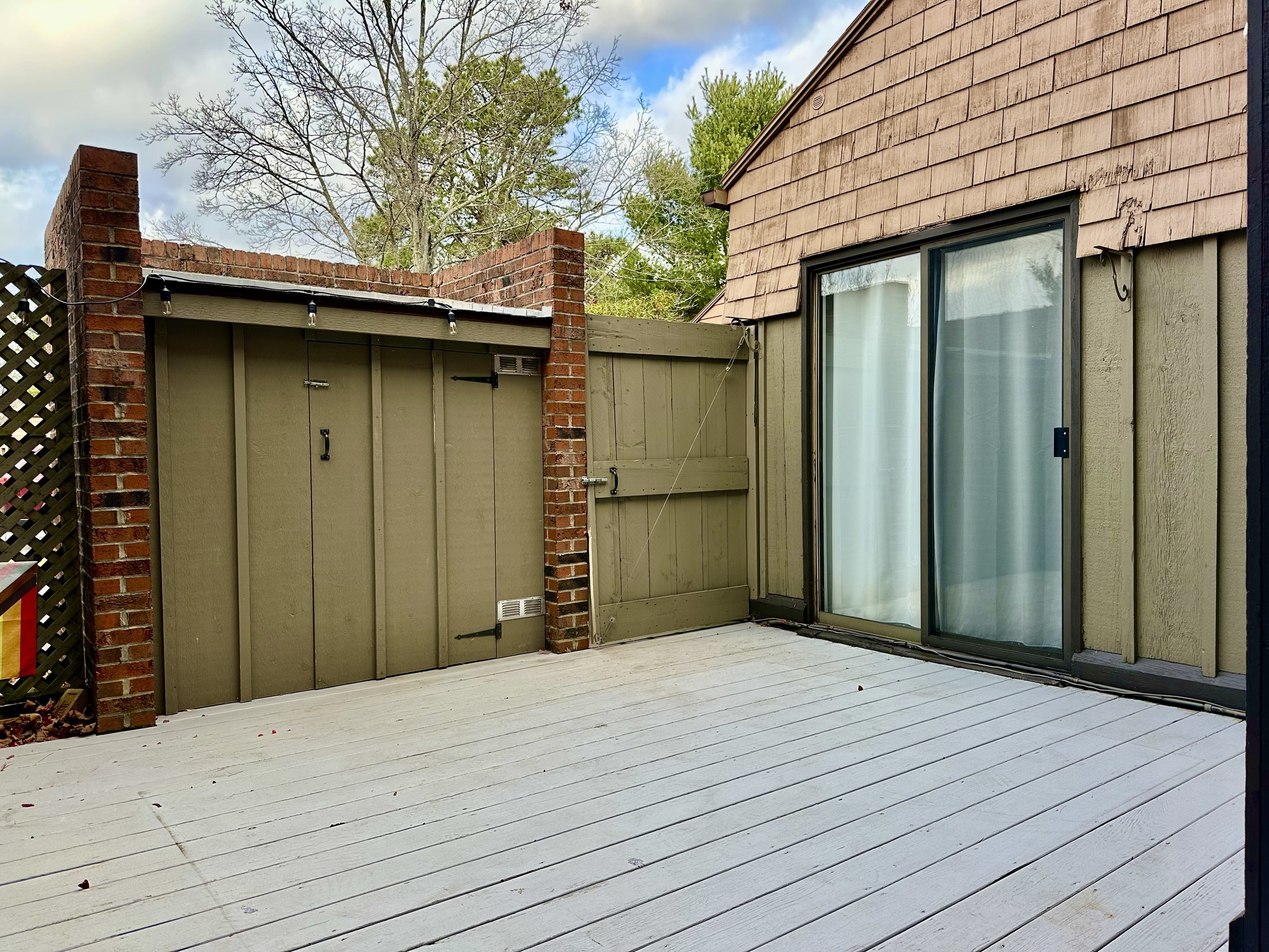 30 Orange Road, Unit 30 Middletown, CT 06457 - Photo 26 of 28 a view of a wooden house with a wooden fence