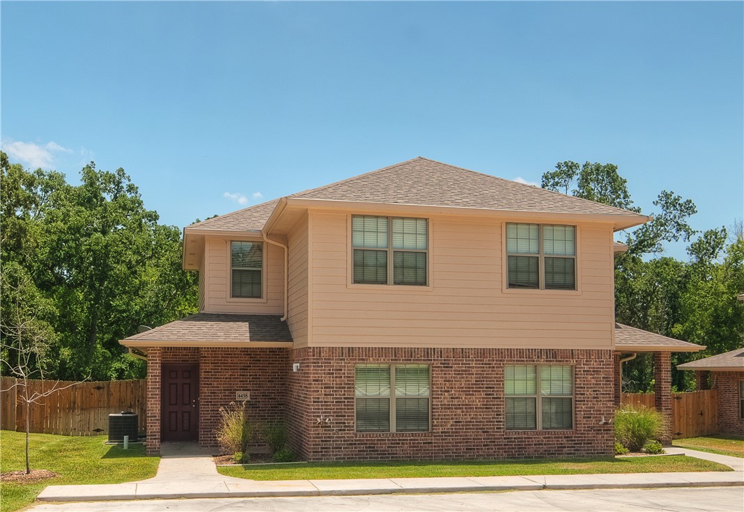 4454 Reveille Road College Station, TX 77845 - Photo 1 of 13 a front view of a house with garden