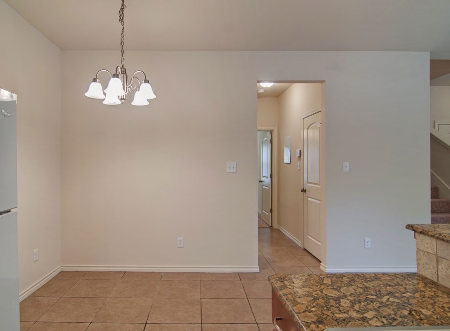 4454 Reveille Road College Station, TX 77845 - Photo 4 of 13 a view of a chandelier in big room and chandelier