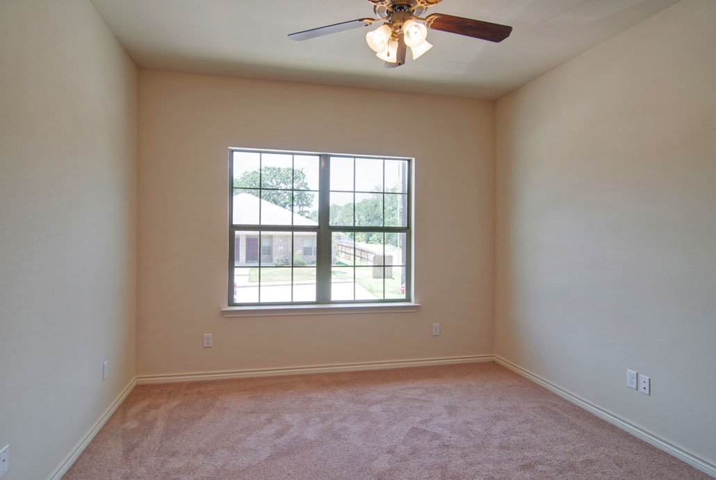 4454 Reveille Road College Station, TX 77845 - Photo 6 of 13 an empty room with a window