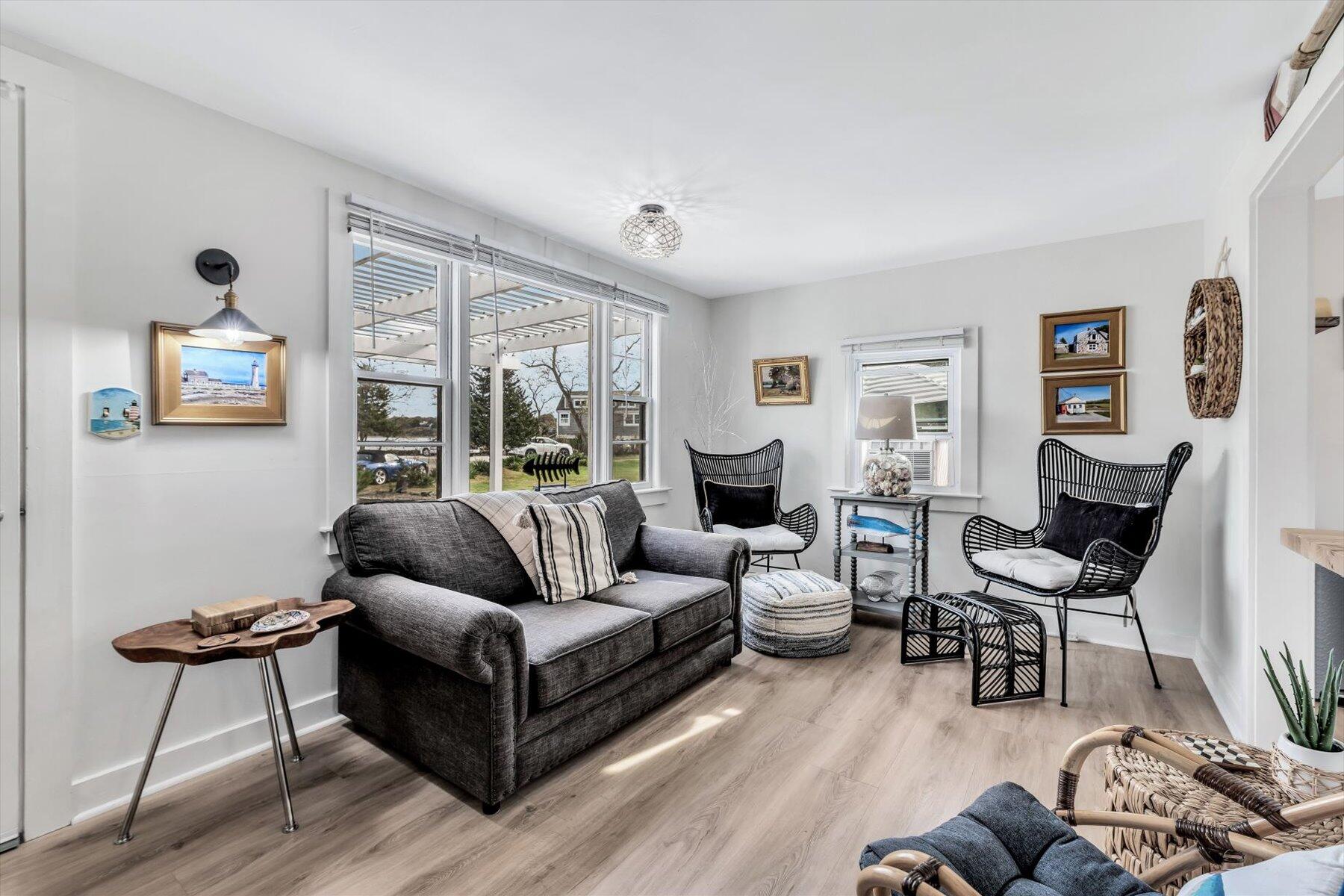 722 State Highway Eastham, MA 02642 - Photo 12 of 31 a living room with furniture and a large window