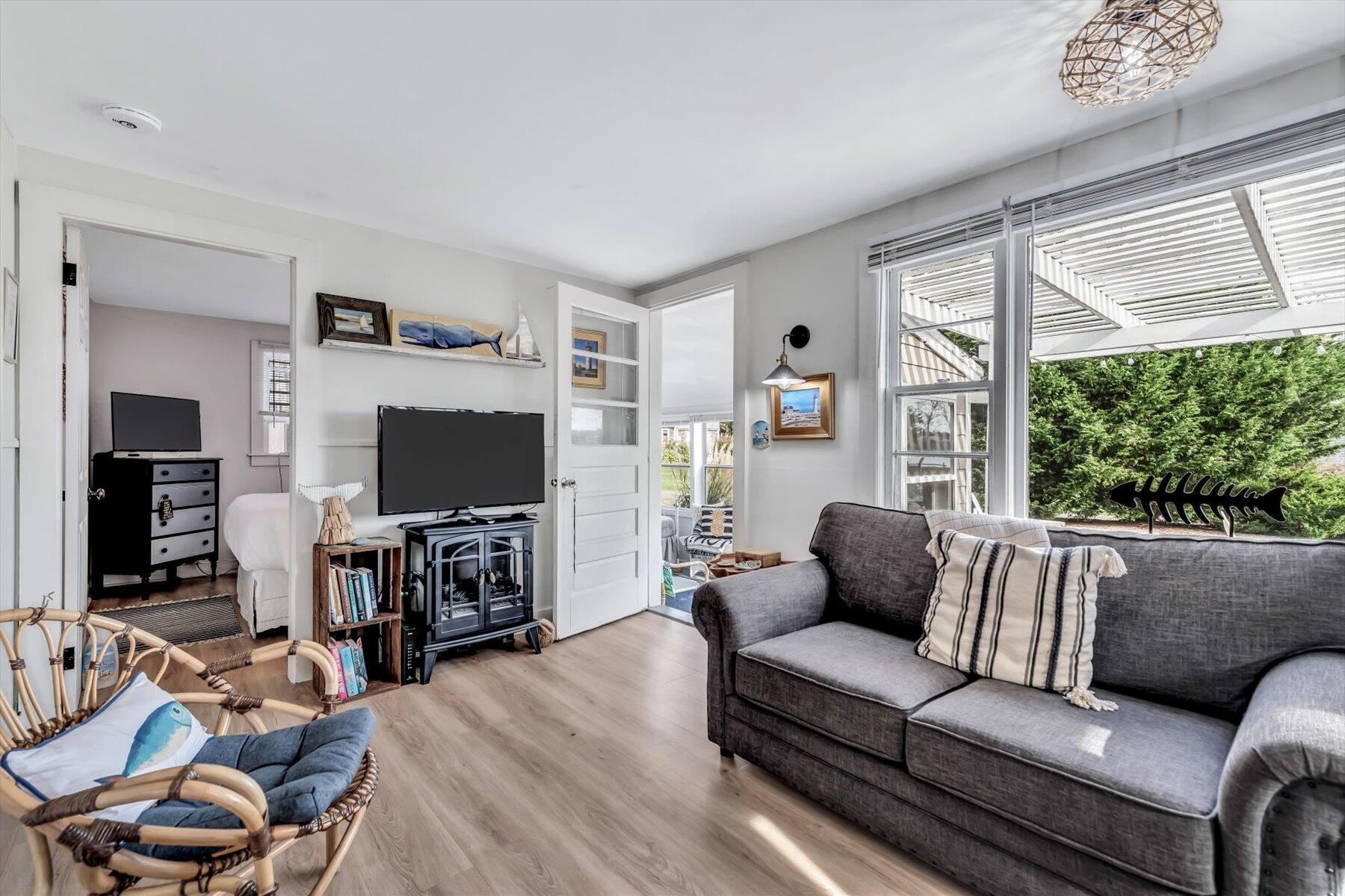 722 State Highway Eastham, MA 02642 - Photo 13 of 31 a living room with furniture and a flat screen tv