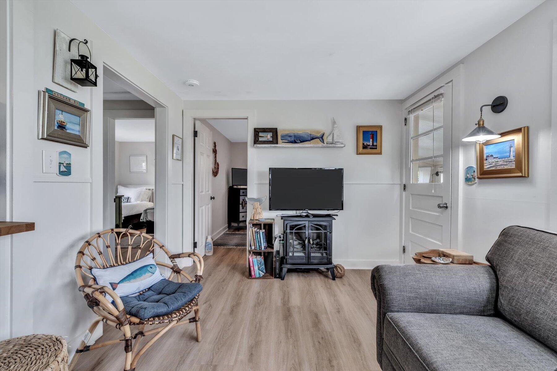 722 State Highway Eastham, MA 02642 - Photo 15 of 31 a living room with furniture and a flat screen tv