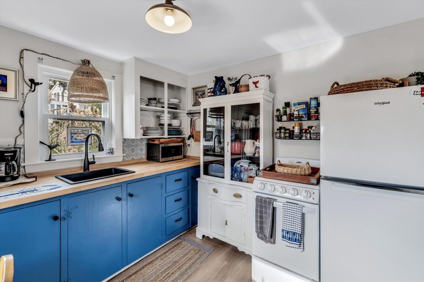 722 State Highway Eastham, MA 02642 - Photo 17 of 31 a kitchen with stainless steel appliances a stove refrigerator and cabinets