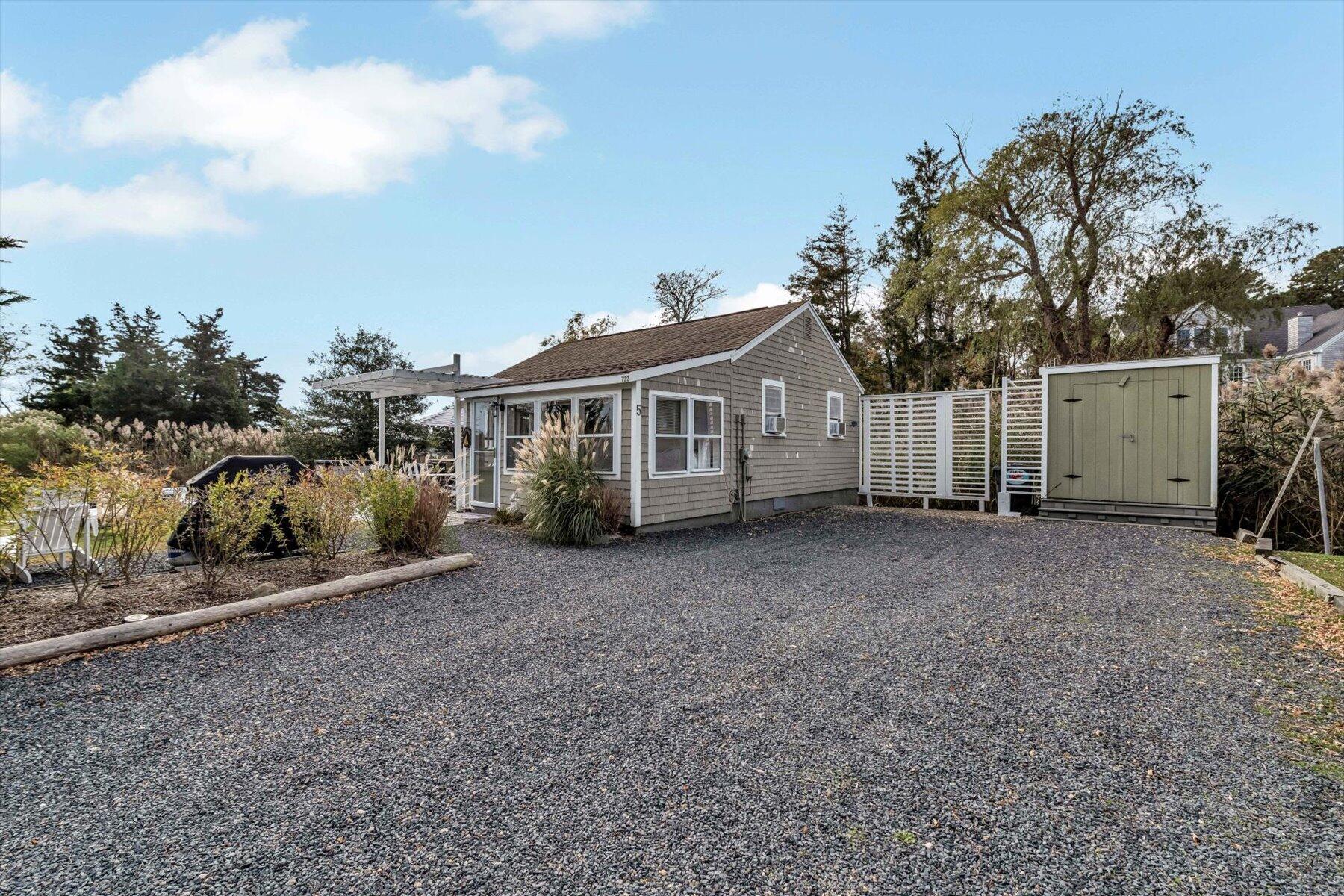 722 State Highway Eastham, MA 02642 - Photo 28 of 31 a view of a house with a backyard