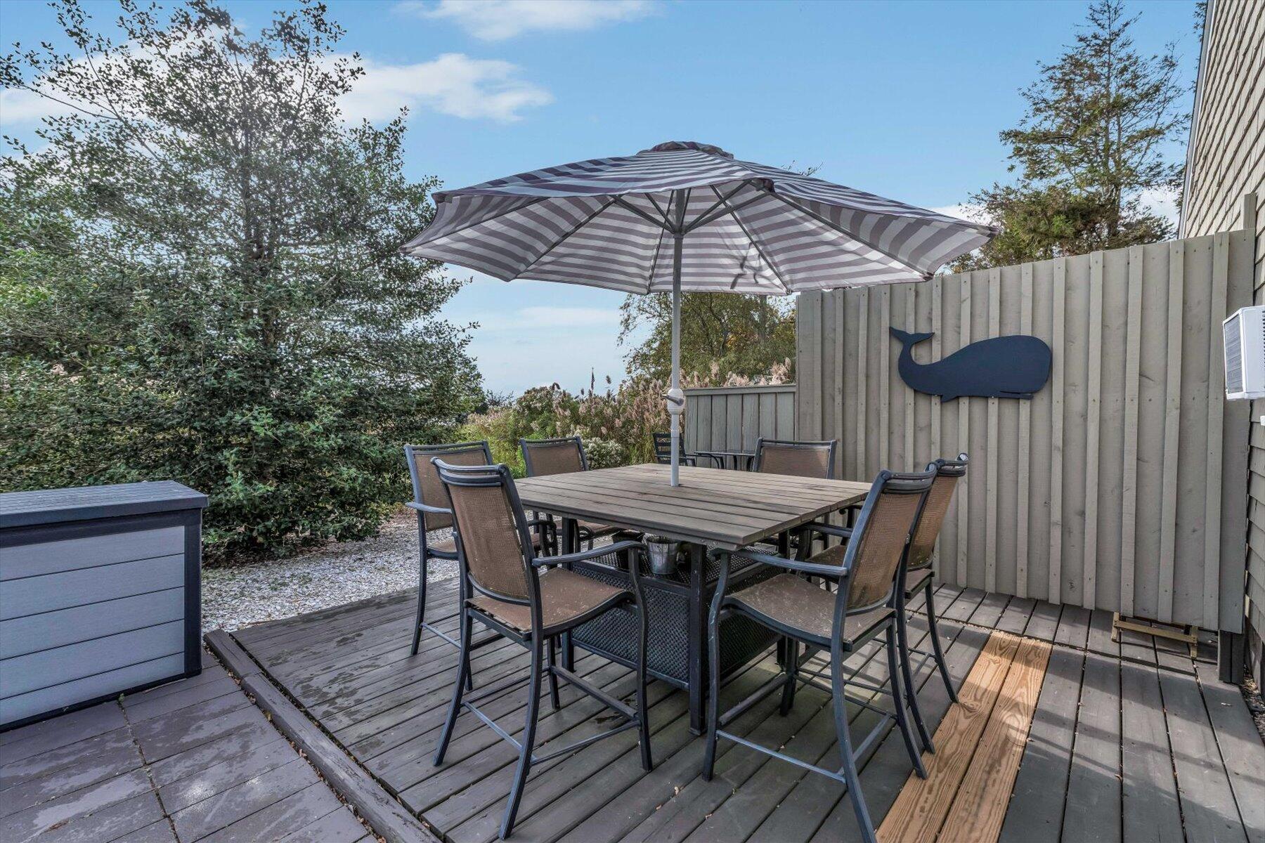 722 State Highway Eastham, MA 02642 - Photo 6 of 31 a view of backyard with table and chairs