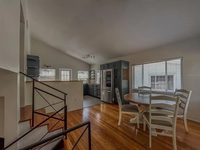 a dining room with furniture and window