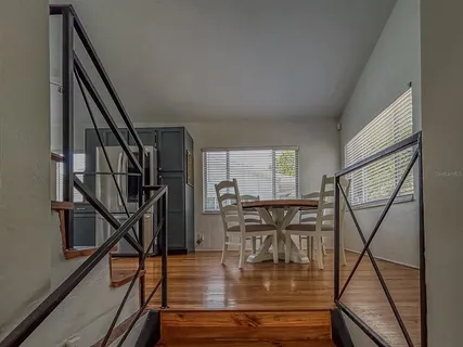 a view of entryway dining room and hall with wooden floor