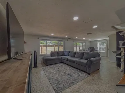 a living room with furniture window and couch
