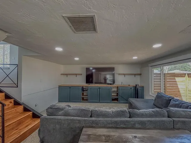 a view of a livingroom with furniture and storage