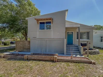 a house with a white fence