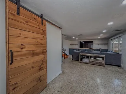 a bathroom with a shower and a sink