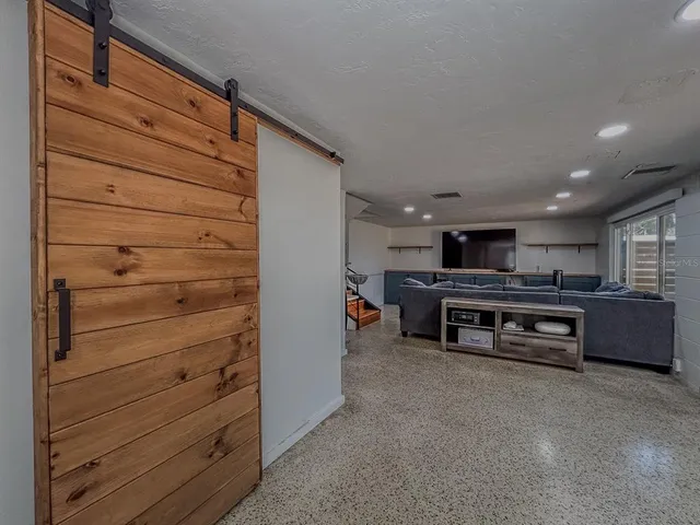 a bathroom with a shower and a sink