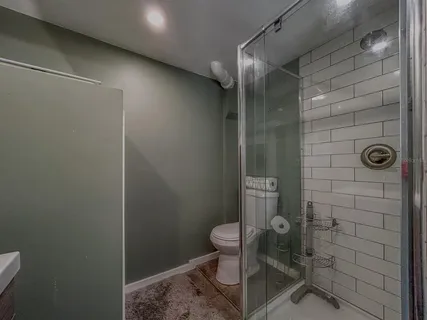 a view of a wooden table and chairs in patio