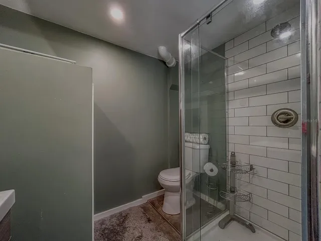 a view of a wooden table and chairs in patio