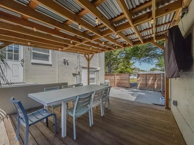 a view of patio with table and chairs