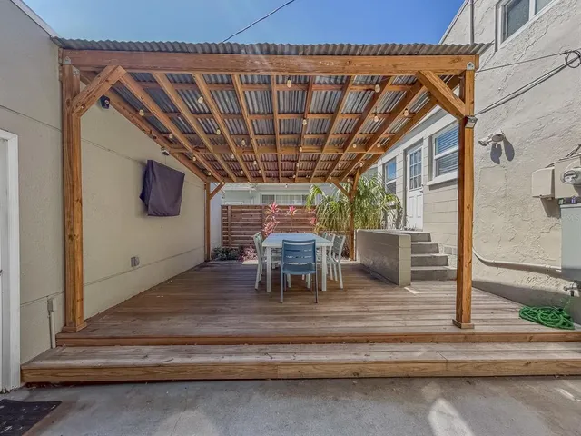 a patio with table and chairs