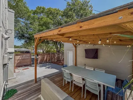 a view of small house with potted plants