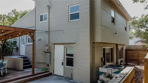 a view of a building with door and outdoor space