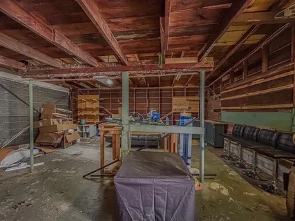 a picture of a bench in front of a wall