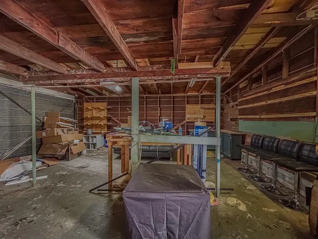 a picture of a bench in front of a wall