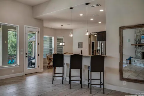 a view of a a dining room with furniture window and wooden floor