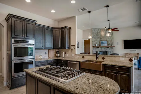 a kitchen with a stove and a sink