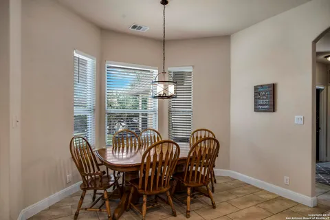 a view of a dining room with furniture window and outside view