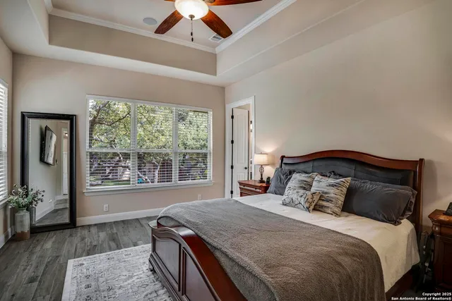 a bedroom with a large bed and a window