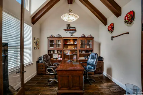 a view of a workspace with furniture