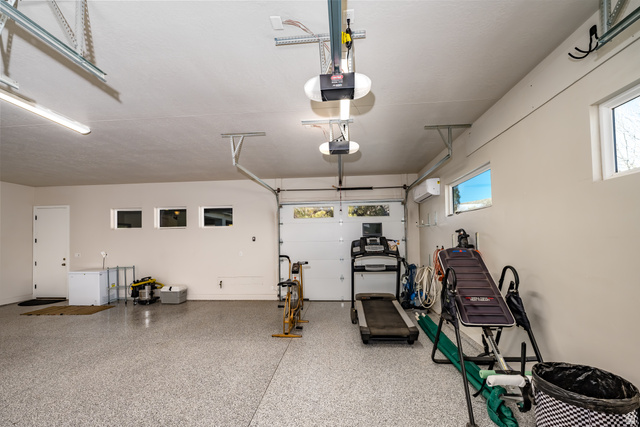 1283 North Gallen Road Santa Clara, UT 84765 - Photo 67 of 103 Garage featuring a garage door opener & epoxy flooring.