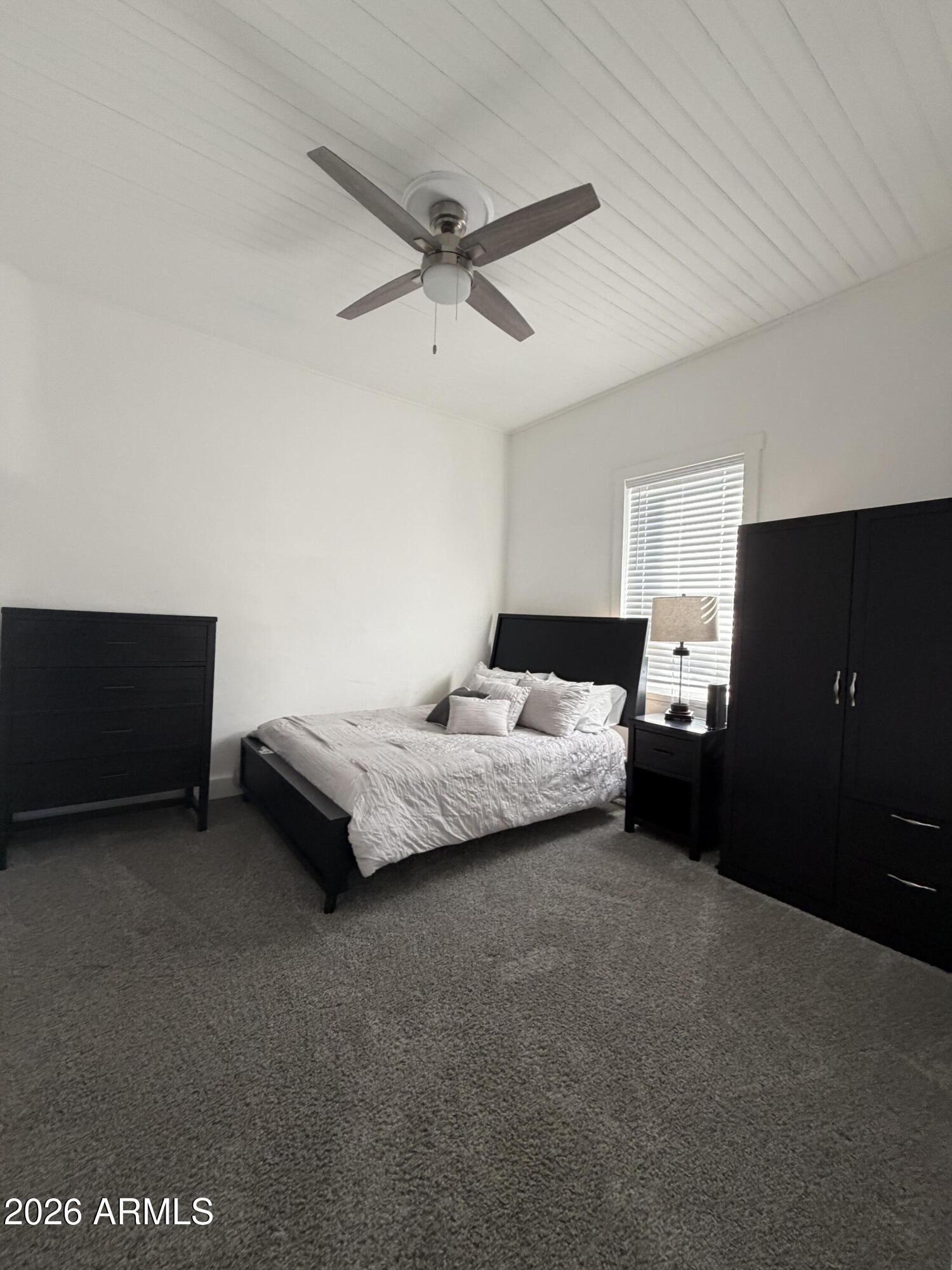 360 Pinal Street Globe, AZ 85501 - Photo 5 of 13 a bedroom with a bed and a night stand